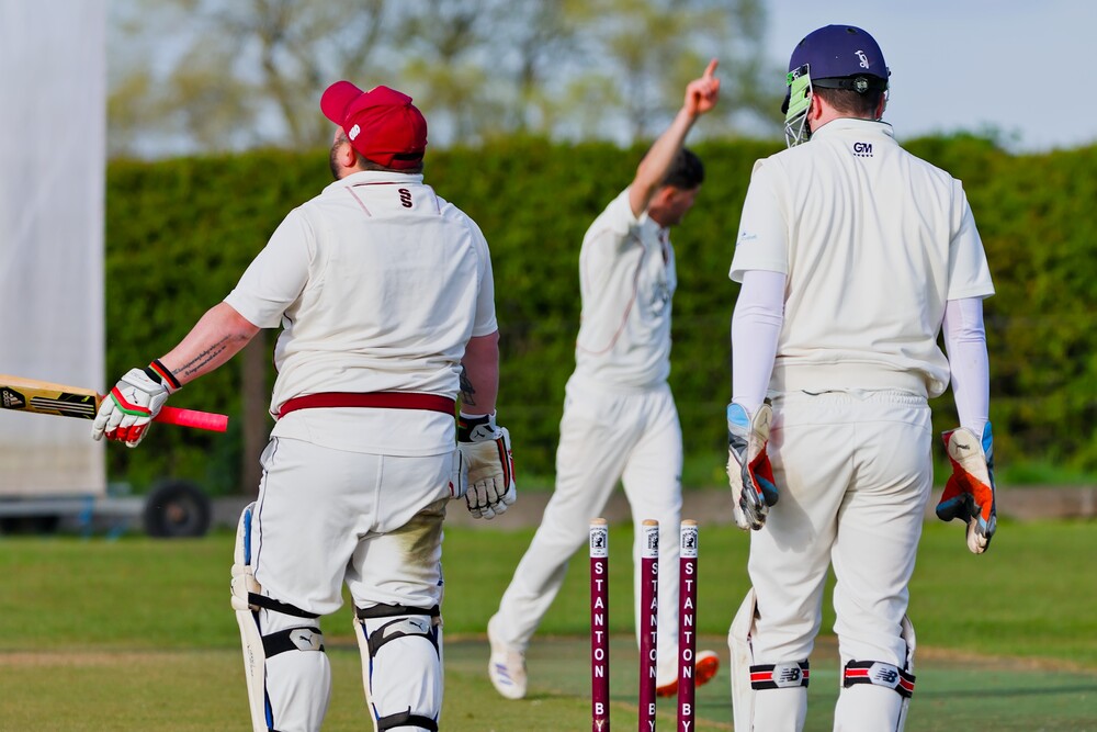 A cricketer celebrating a wicket.